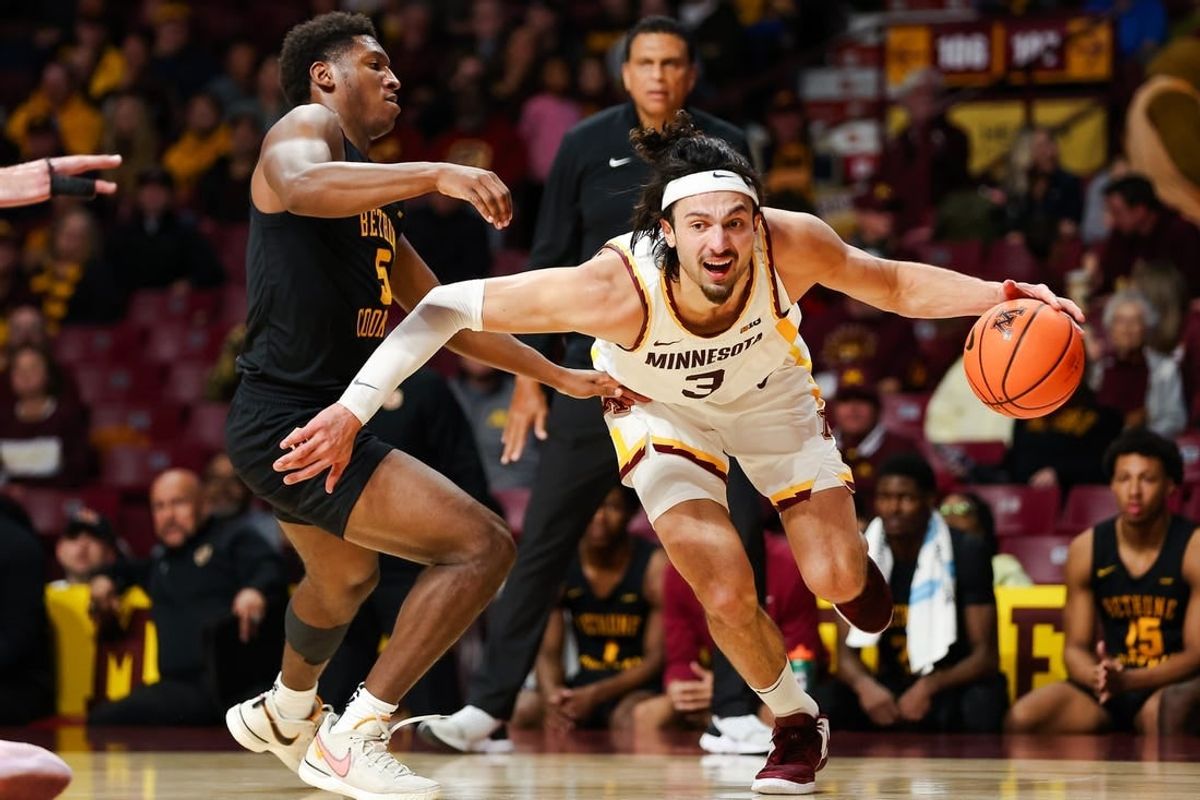 Nov 6, 2023; Minneapolis, Minnesota, USA; Minnesota Golden Gophers forward Dawson Garcia (3) drives around Bethune-Cookman Wildcats guard Damani McEntire (5) during the first half at Williams Arena.
