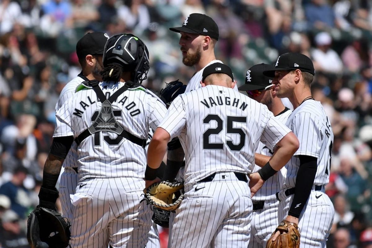Apr 13, 2024; Chicago, Illinois, USA; Chicago White Sox starting pitcher Garrett Crochet (center) meets with teammates at the mound during the second inning against the Cincinnati Reds at Guaranteed Rate Field.