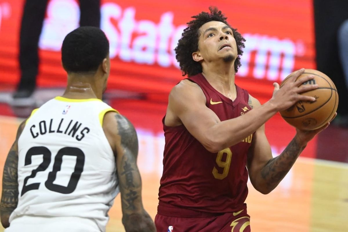 Dec 20, 2023; Cleveland, Ohio, USA; Cleveland Cavaliers guard Craig Porter (9) drives to the basket as Utah Jazz forward John Collins (20) defends in the second quarter at Rocket Mortgage FieldHouse.