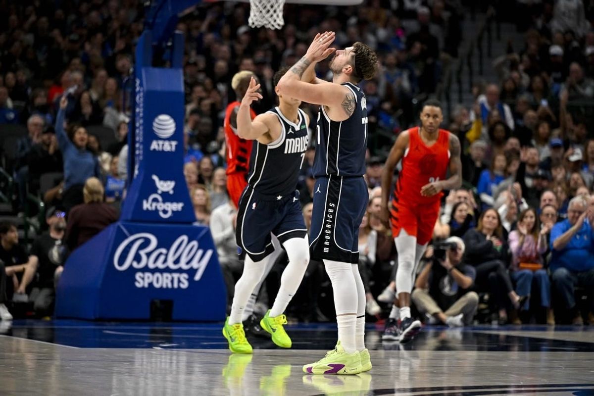 Jan 3, 2024; Dallas, Texas, USA; Dallas Mavericks guard Luka Doncic (77) celebrates after making a three point basket against the Portland Trail Blazers during the second quarter at the American Airlines Center.