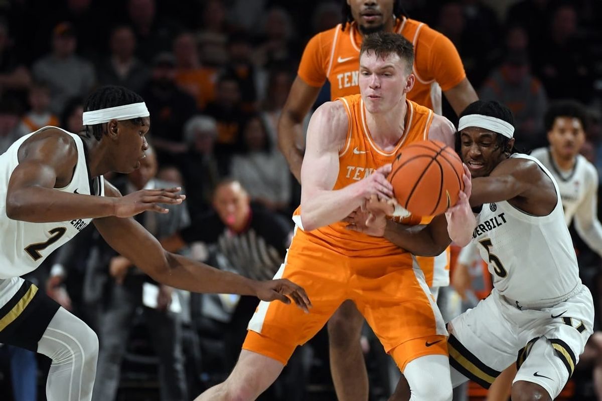 Jan 27, 2024; Nashville, Tennessee, USA; Tennessee Volunteers guard Dalton Knecht (3) is defended by Vanderbilt Commodores guard Ezra Manjon (5) and forward Ven-Allen Lubin (2) during the first half at Memorial Gymnasium.