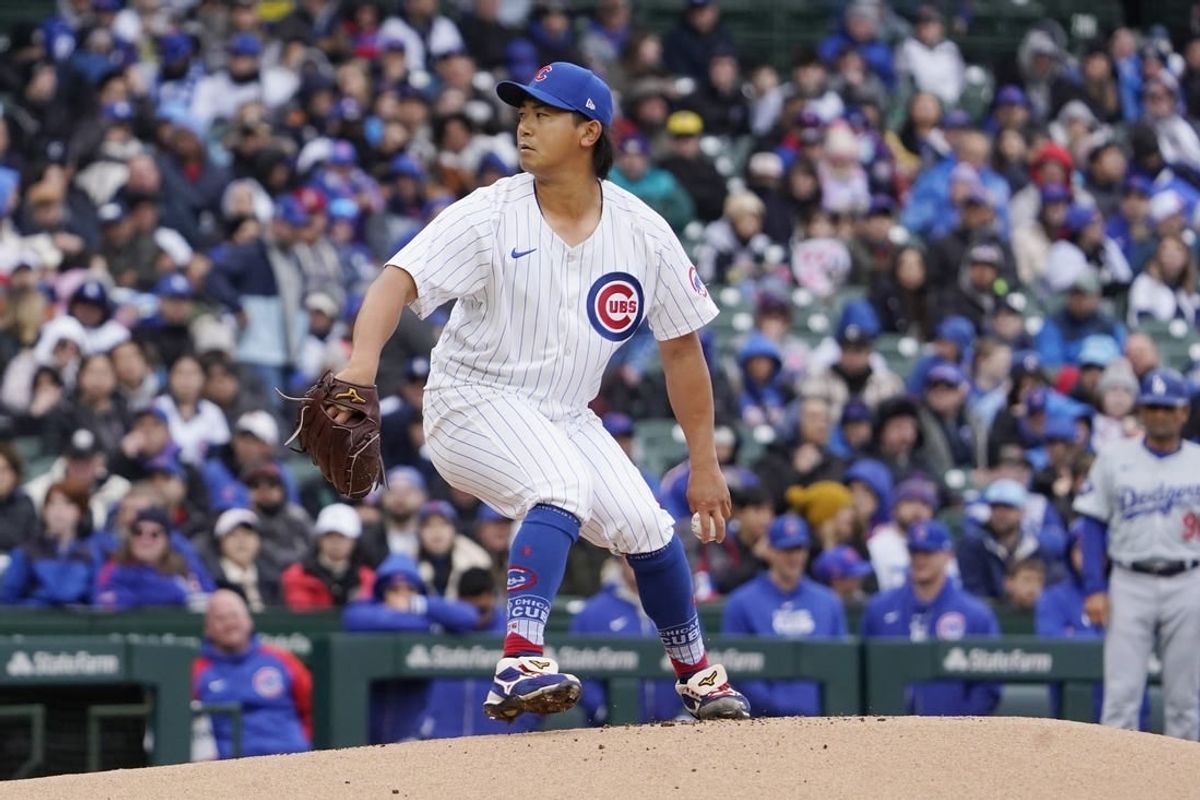 Apr 7, 2024; Chicago, Illinois, USA; Chicago Cubs pitcher Shota Imanaga (18) pitches against the Los Angeles Dodgers during the first inning at Wrigley Field.