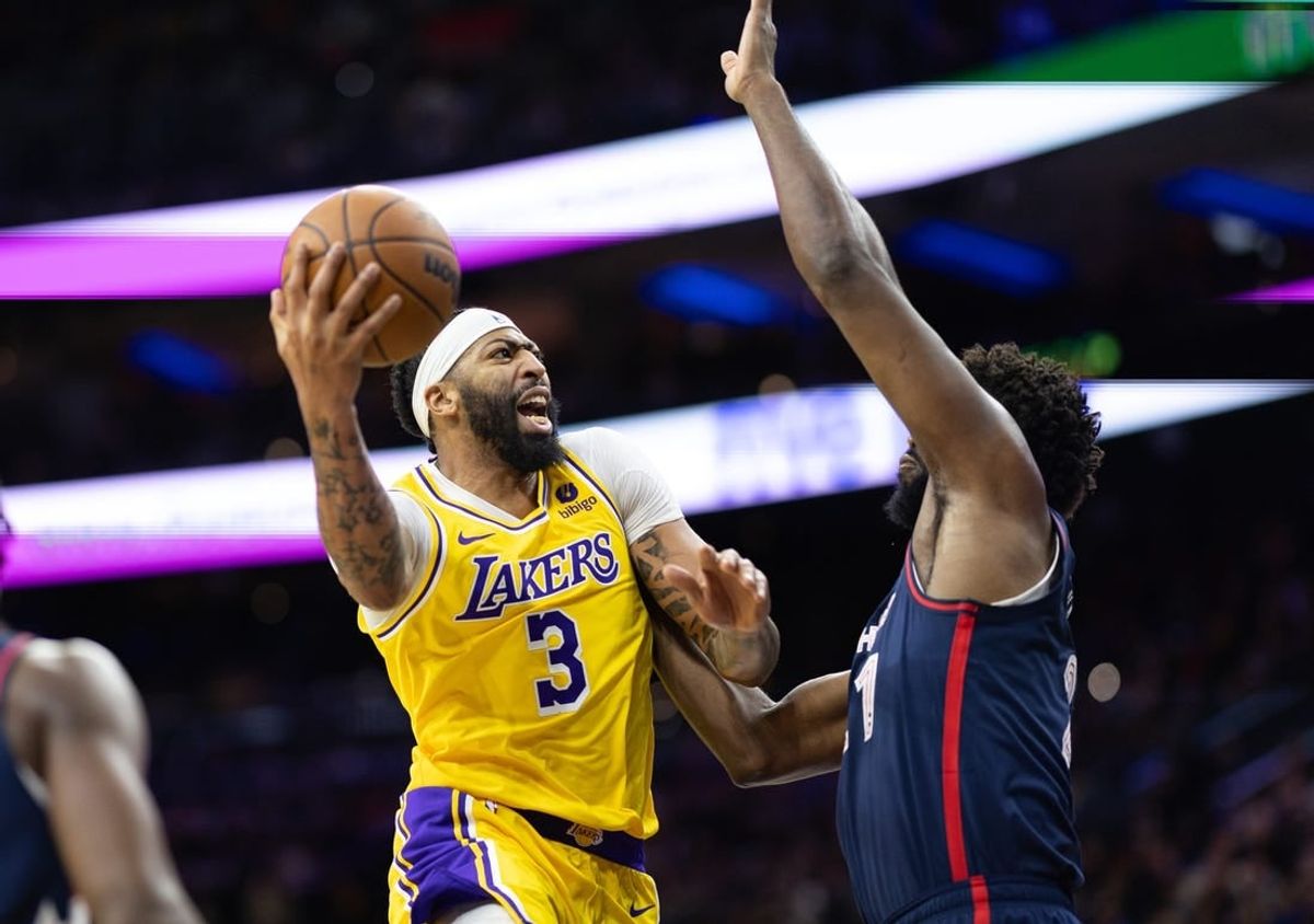 Nov 27, 2023; Philadelphia, Pennsylvania, USA; Los Angeles Lakers forward Anthony Davis (3) drives for a shot against Philadelphia 76ers center Joel Embiid (21) during the second quarter at Wells Fargo Center.