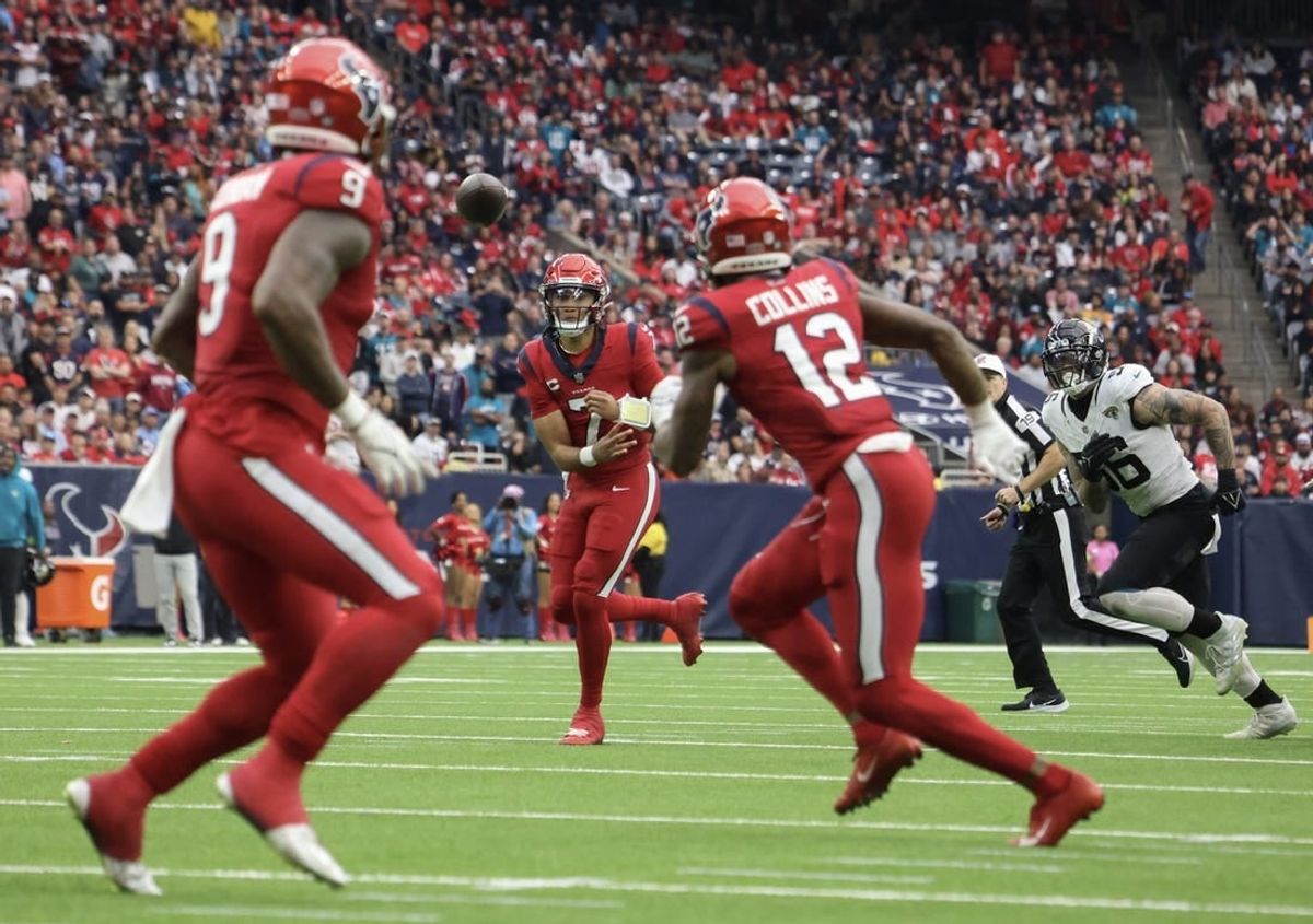 Houston Texans quarterback C.J. Stroud (7) throws a touchdown pass to  wide receiver Nico Collins (12) against the Jacksonville Jaguars in the second half at NRG Stadium.