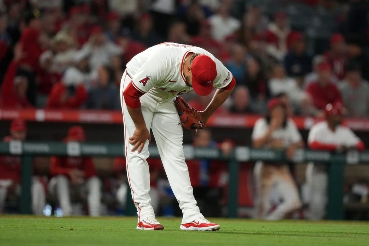 Apr 30, 2024; Anaheim, California, USA; Los Angeles Angels pitcher Carlos Estevez (53) reacts after surrendering a home run in the ninth inning against the Philadelphia Phillies at Angel Stadium.