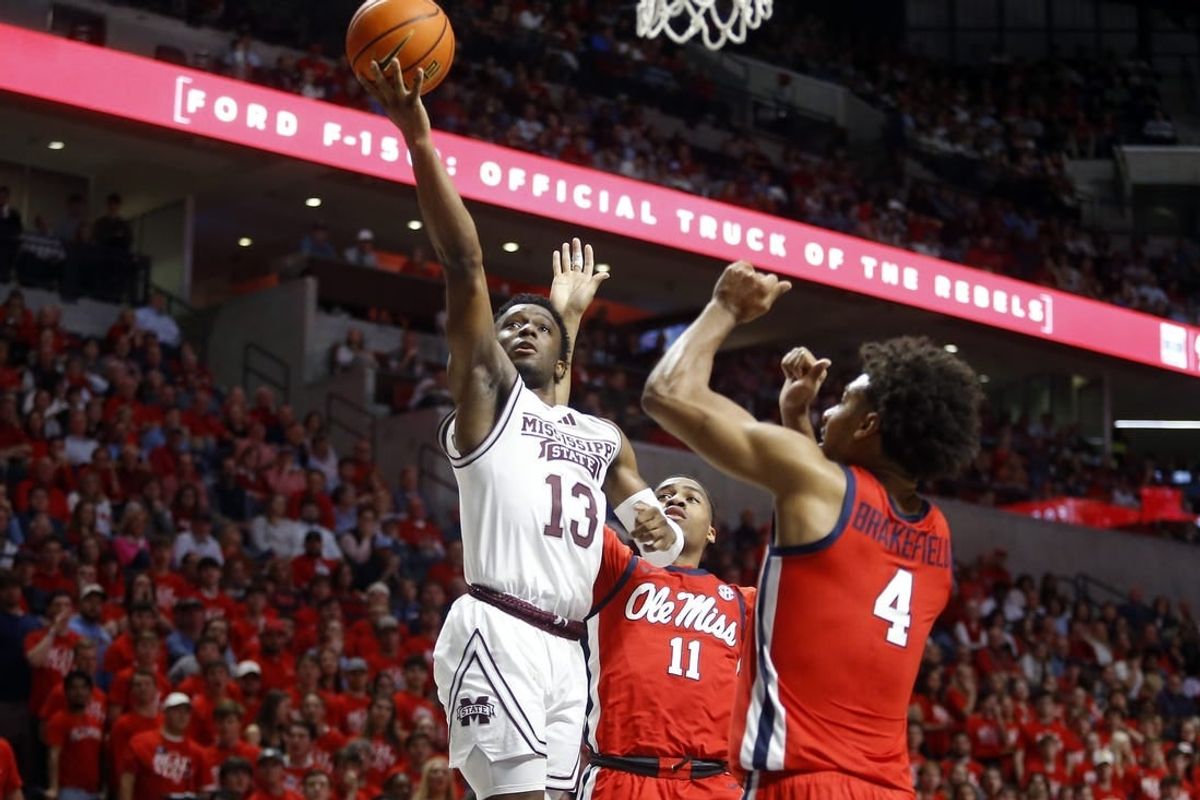 Jan 30, 2024; Oxford, Mississippi, USA; Mississippi State Bulldogs guard Josh Hubbard (13) drives to the basket as Mississippi Rebels guard Matthew Murrell (11) and forward Jaemyn Brakefield (4) defends during the first half at The Sandy and John Black Pavilion at Ole Miss.