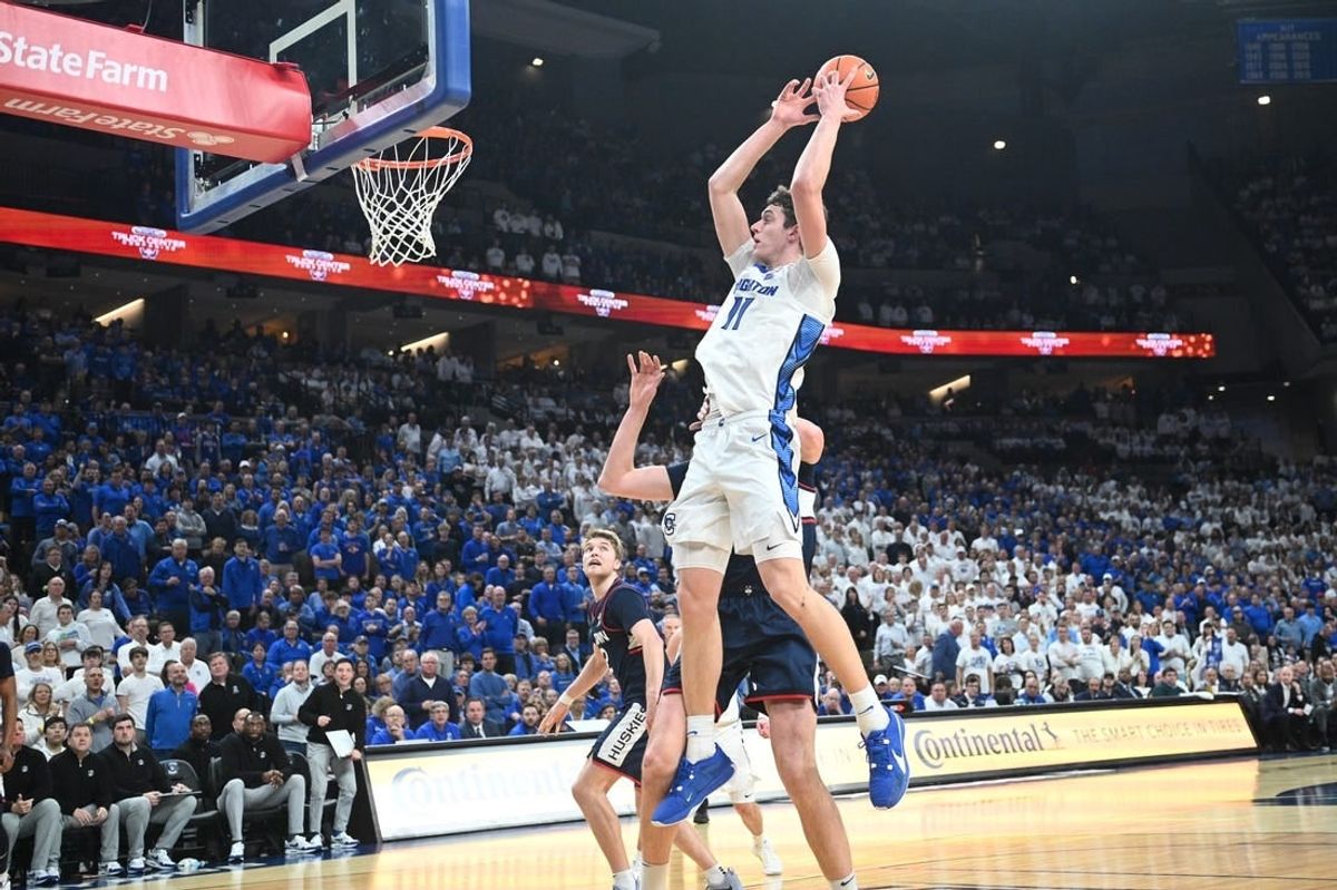 Feb 20, 2024; Omaha, Nebraska, USA; Creighton Bluejays center Ryan Kalkbrenner (11) grabs a pass against the Connecticut Huskies in the second half at CHI Health Center Omaha.