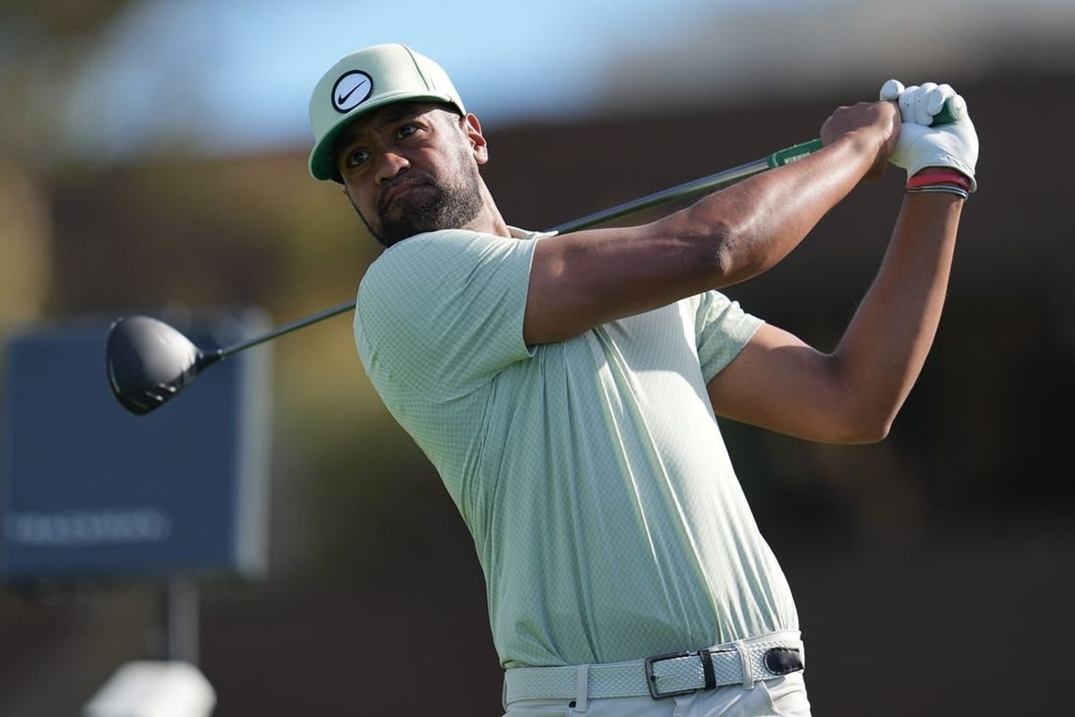 Jan 27, 2024; San Diego, California, USA; Tony Finau hits his tee shot on the fourteenth hole during the final round of the Farmers Insurance Open golf tournament at Torrey Pines Municipal Golf Course - South Course.
