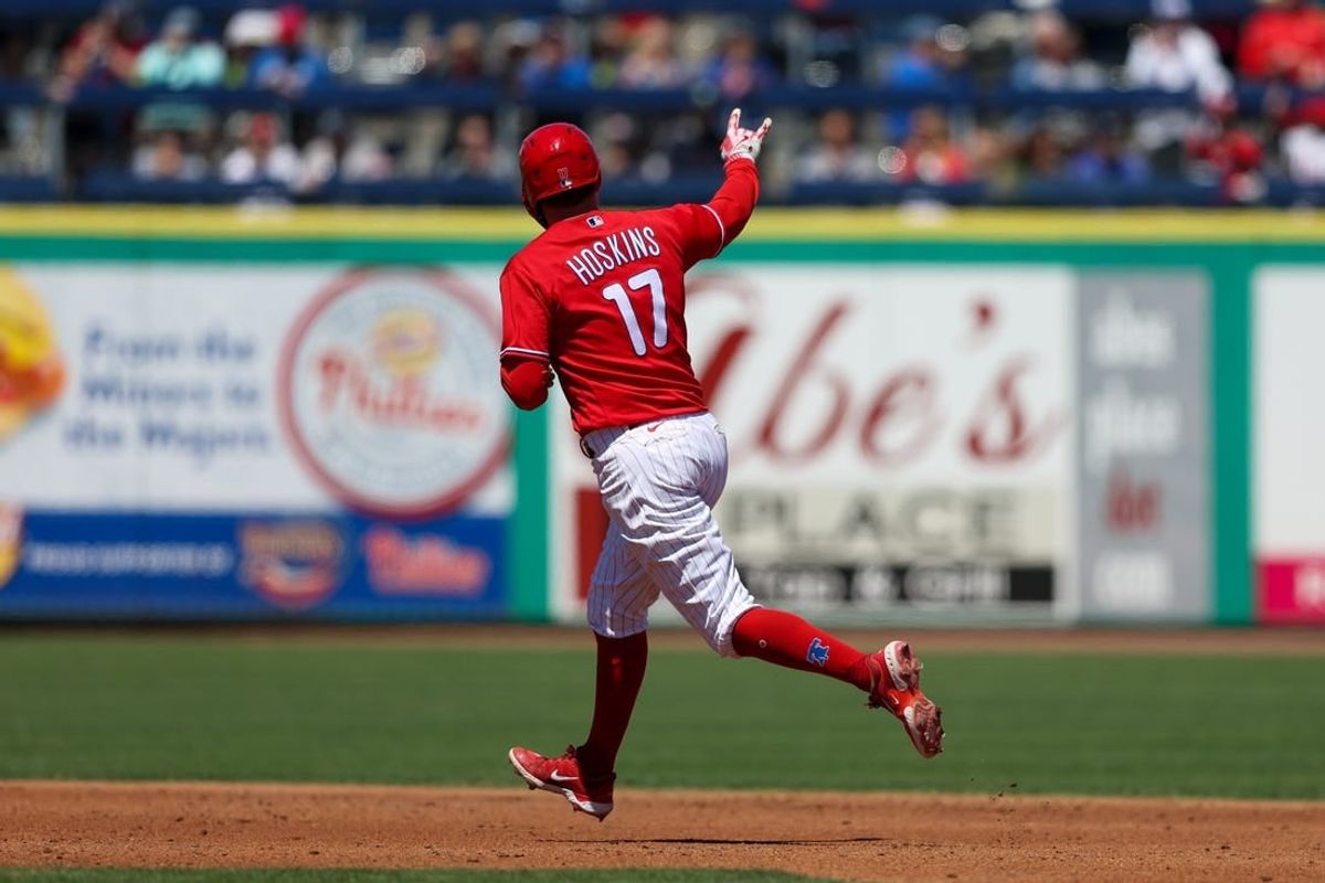 Mar 20, 2023; Clearwater, Florida, USA;  Philadelphia Phillies first baseman Rhys Hoskins (17) rounds the bases after hitting a two-run home run against the Baltimore Orioles in the second inning during spring training at BayCare Ballpark.