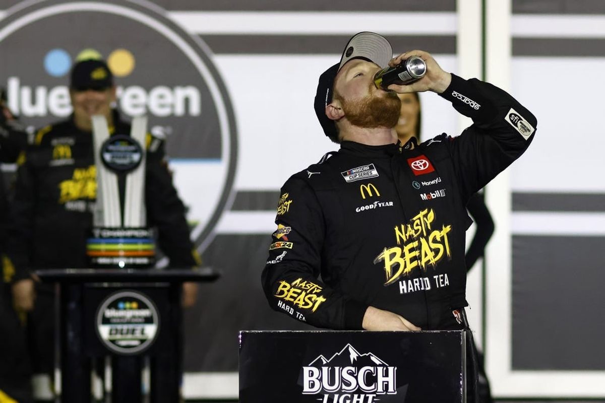 Feb 15, 2024; Daytona Beach, Florida, USA; NASCAR Cup Series driver Tyler Reddick (45) reacts in victory lane after winning the Bluegreen Vacations Duel 1 at Daytona International Speedway.
