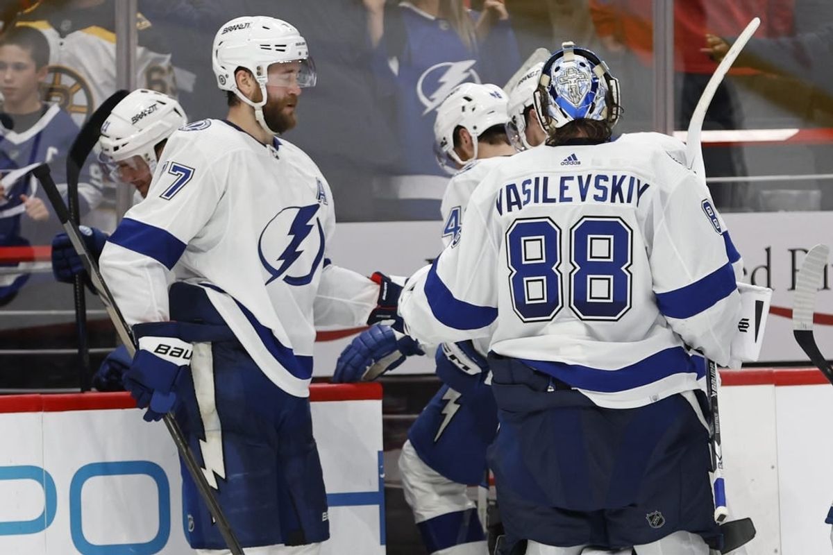 Dec 23, 2023; Washington, District of Columbia, USA; Tampa Bay Lightning goaltender Andrei Vasilevskiy (88) celebrates with Lightning defenseman Victor Hedman (77) after their game against the Washington Capitals at Capital One Arena.