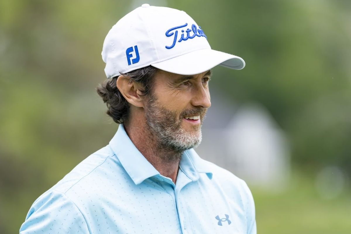 May 26, 2022; Benton Harbor, Michigan, USA; Mark Hensby smiles on the 18th green during the first round of the 2022 KitchenAid Senior PGA Championship at Harbor Shores.