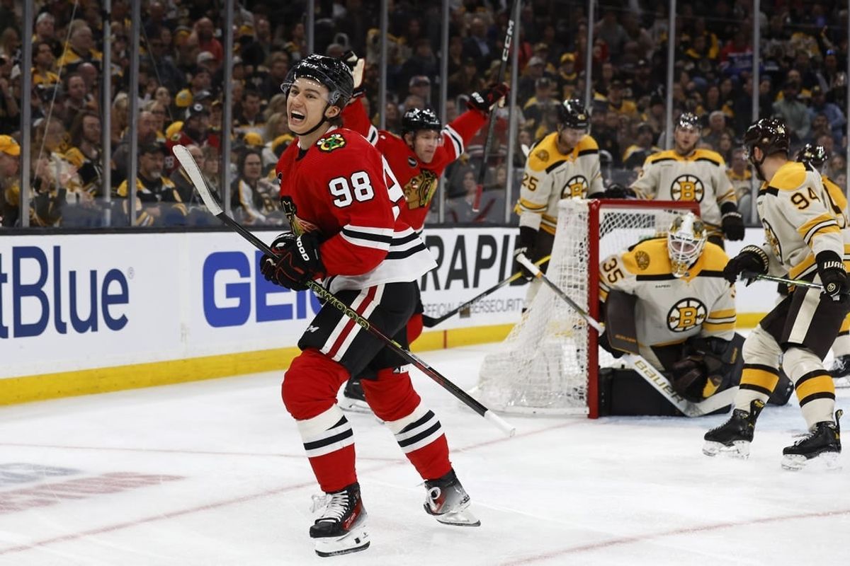 Oct 11, 2023; Boston, Massachusetts, USA; Chicago Blackhawks center Connor Bedard (98) celebrates after scoring his first NHL goal on Boston Bruins goaltender Linus Ullmark (35) during the first period at TD Garden.