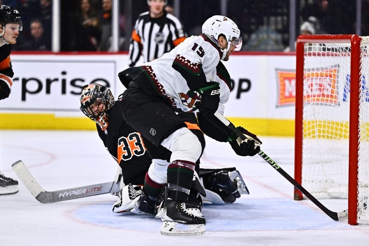 Feb 12, 2024; Philadelphia, Pennsylvania, USA; Arizona Coyotes center Alex Kerfoot (15) scores a goal against Philadelphia Flyers goalie Samuel Ersson (33) in the second period at Wells Fargo Center.
