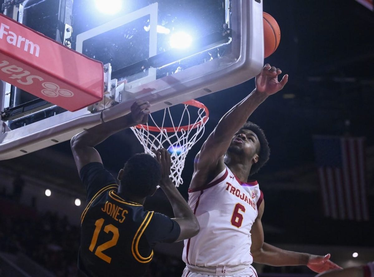 Dec 10, 2023; Los Angeles, California, USA; USC Trojans guard Bronny James (6) blocks a shot by Long Beach State 49ers guard Jadon Jones (12) in the first half at Galen Center. It was James  first game of the season since suffering a near fatal heat attack.