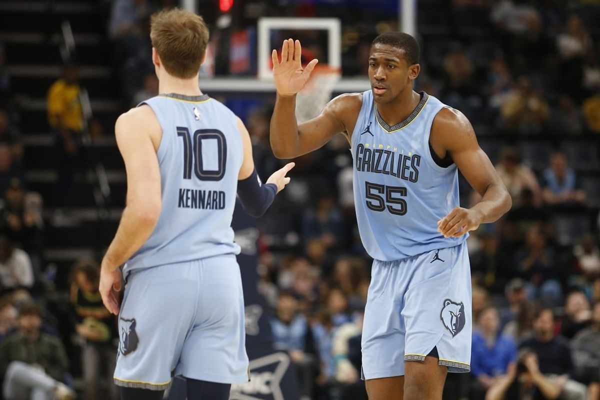 Mar 12, 2024; Memphis, Tennessee, USA; Memphis Grizzlies center Trey Jemison (55) reacts with guard Luke Kennard (10) during the second half against the Washington Wizards at FedExForum.