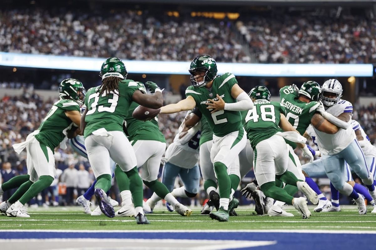 Sep 17, 2023; Arlington, Texas, USA; New York Jets quarterback Zach Wilson (2) hands off to running back Dalvin Cook (33) in the third quarter against the Dallas Cowboys at AT&T Stadium.