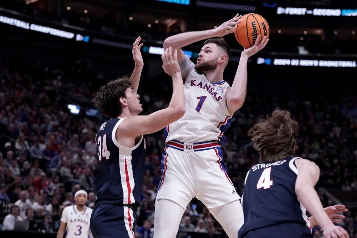 Mar 23, 2024; Salt Lake City, UT, USA; Kansas Jayhawks center Hunter Dickinson (1) shoots against Gonzaga Bulldogs forward Braden Huff (34) during the first half in the second round of the 2024 NCAA Tournament at Vivint Smart Home Arena-Delta Center.