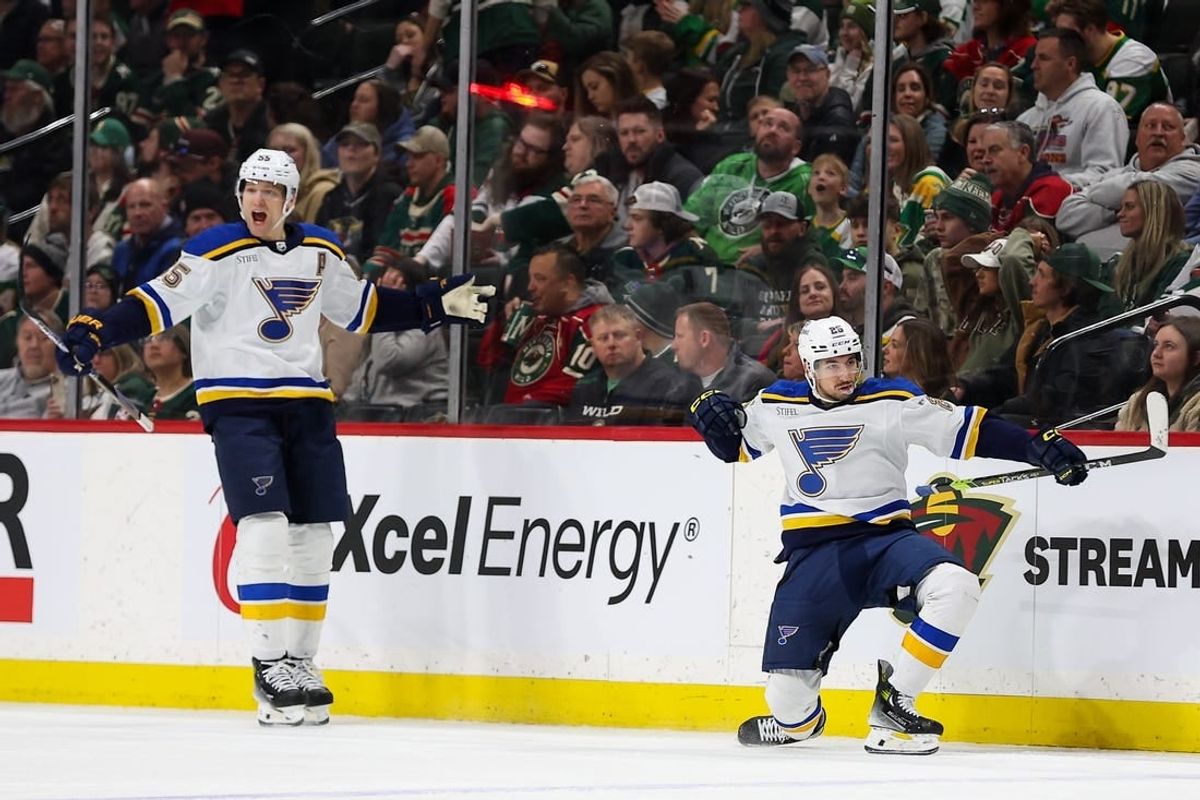 Mar 23, 2024; Saint Paul, Minnesota, USA; St. Louis Blues center Jordan Kyrou (25) celebrates his hat-trick against the Minnesota Wild during the third period at Xcel Energy Center.