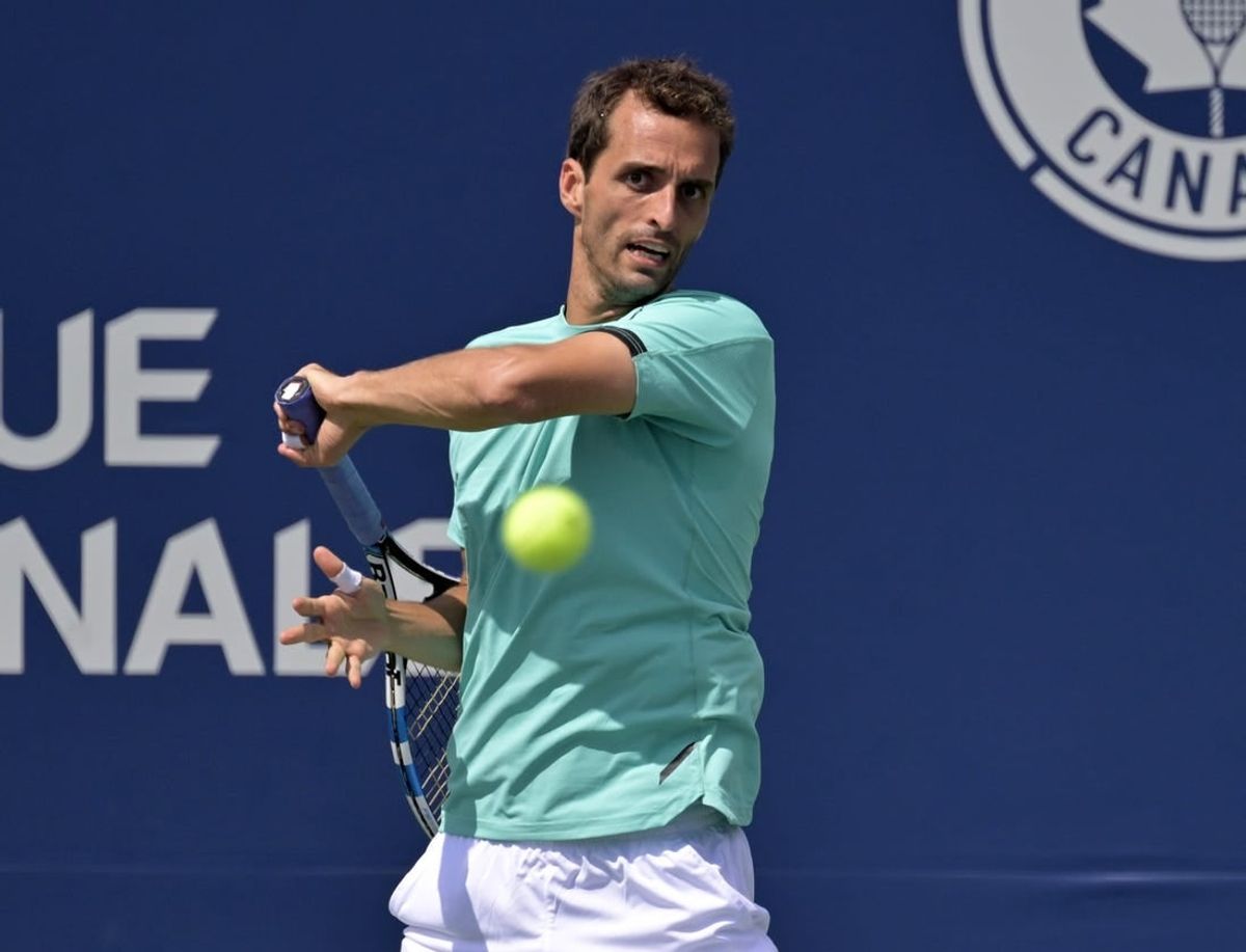 Aug 11, 2022; Montreal, QC, Canada; Albert Ramos-Vinolas (ESP) hits a forehand against against Hubert Hurkacz (POL) (not pictured) in third round play in the National Bank Open at IGA Stadium.