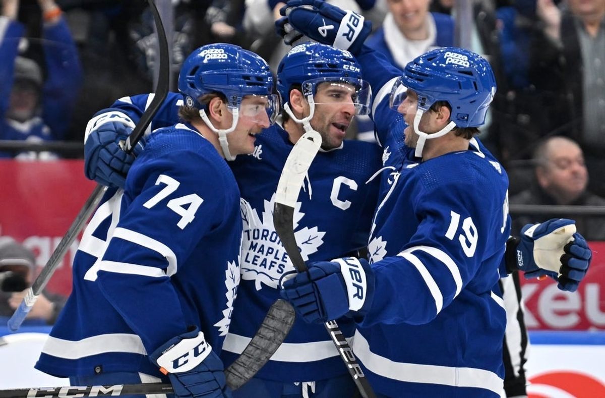 Mar 2, 2024; Toronto, Ontario, CAN;  Toronto Maple Leafs forward John Tavares (91) celebrates with forwards Bobby McMann (74) and Calle Jarnkrok (19) after scoring against the New York Rangers in the third period at Scotiabank Arena.