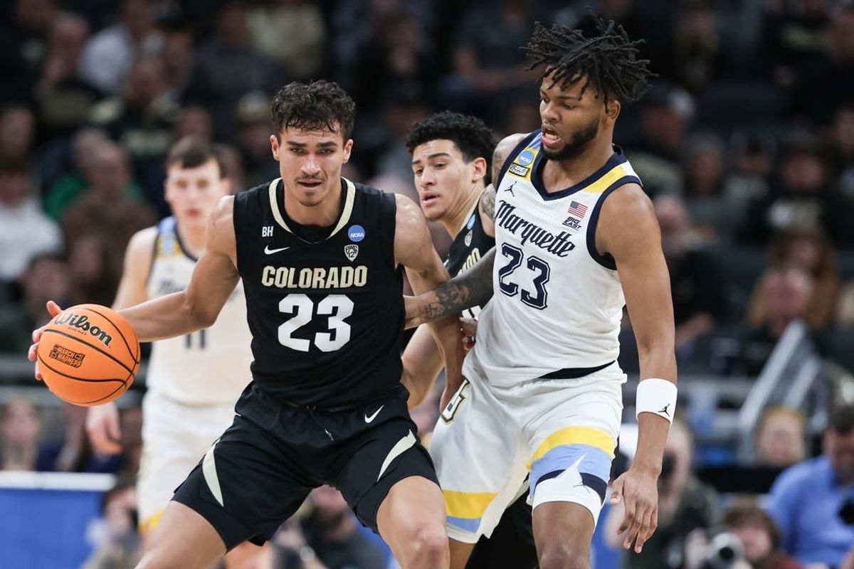 Mar 24, 2024; Indianapolis, IN, USA; Colorado Buffaloes forward Tristan da Silva (23) dribbles against Marquette Golden Eagles forward David Joplin (23) during the first half at Gainbridge FieldHouse.