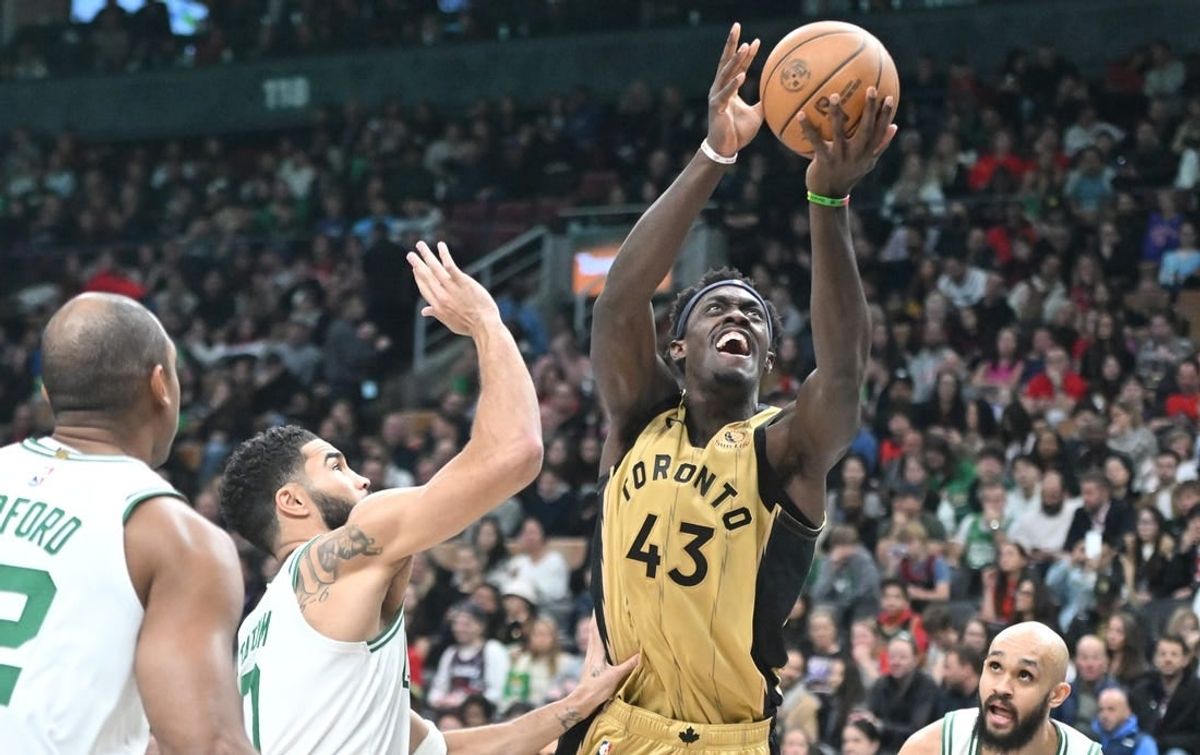 Nov 17, 2023; Toronto, Ontario, CAN;   Toronto Raptors forward Pascal Siakam (43) shoots the ball over Boston Celtics forward Jayson Tatum (0) in the second half at Scotiabank Arena.