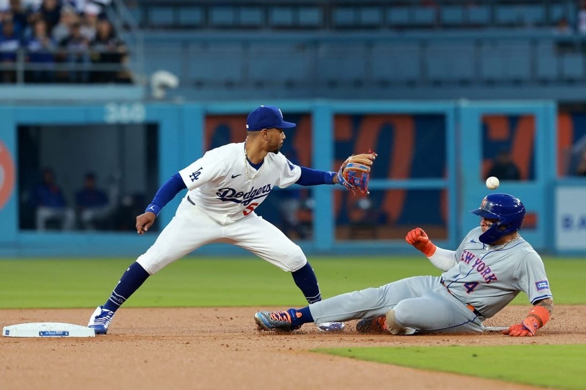 Apr 19, 2024; Los Angeles, California, USA;  New York Mets catcher Francisco Alvarez (4) is safe at second ahead of a throw to Los Angeles Dodgers shortstop Mookie Betts (50) during the second inning at Dodger Stadium.