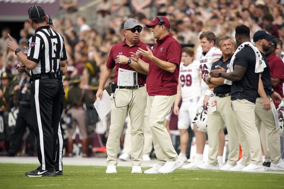 Oct 28, 2023; College Station, Texas, USA; South Carolina Gamecocks head coach Shane Beamer and assistant coach Pete Lembo work the sideline during the second quarter in a game against Texas A&M Aggies at Kyle Field.