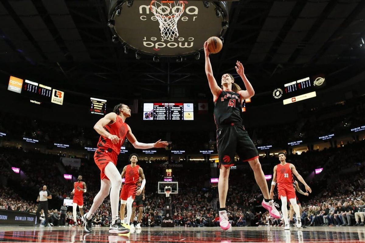 Mar 9, 2024; Portland, Oregon, USA; Toronto Raptors power forward Kelly Olynyk (41) shoots the ball as Portland Trail Blazers guard Dalano Banton (5) looks on during the first half at Moda Center.