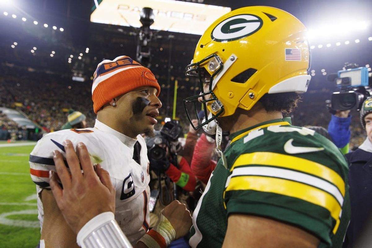 Jan 7, 2024; Green Bay, Wisconsin, USA;  Chicago Bears quarterback Justin Fields (1) greets Green Bay Packers quarterback Jordan Love (10) following the game at Lambeau Field.