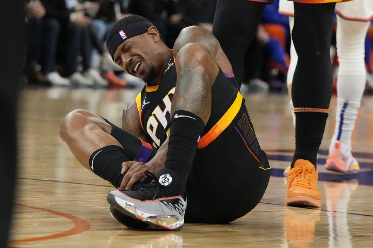 Dec 15, 2023; Phoenix, Arizona, USA; Phoenix Suns guard Bradley Beal (3) reacts after getting hurt against the New York Knicks in the first half at Footprint Center.