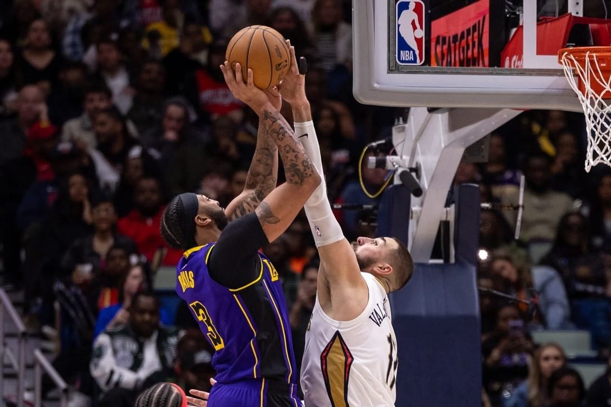 Dec 31, 2023; New Orleans, Louisiana, USA;  New Orleans Pelicans center Jonas Valanciunas (17) blocks the jump shot attempt by Los Angeles Lakers forward Anthony Davis (3) during the second half at Smoothie King Center.