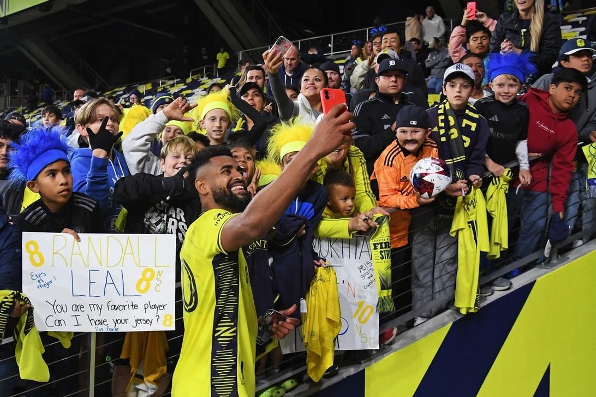 Oct 14, 2023; Nashville, Tennessee, USA; Nashville SC midfielder Anibal Godoy (20) celebrates with fans after the game against New England Revolution at Geodis Park.