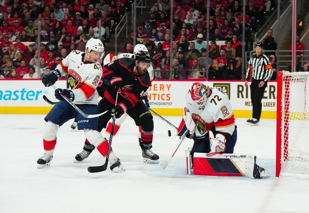 Mar 14, 2024; Raleigh, North Carolina, USA; Carolina Hurricanes left wing Jordan Martinook (48) shot attempt is stopped by Florida Panthers goaltender Sergei Bobrovsky (72) and defenseman Gustav Forsling (42) during the first period at PNC Arena.