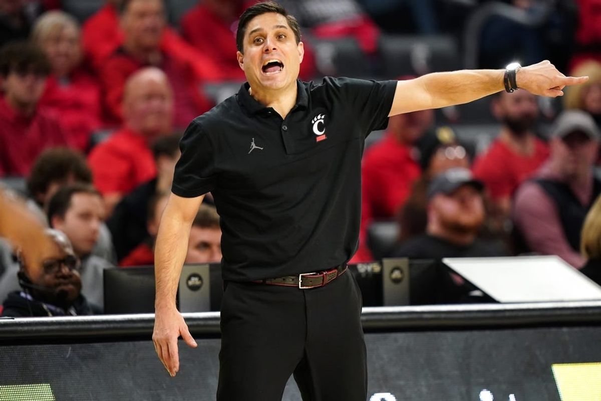Cincinnati Bearcats head coach Wes Miller instructs the team in the second half during an NCAA college basketball game between Georgia Tech Yellow Jackets and the Cincinnati Bearcats, Wednesday, Nov. 22, 2023, at Fifth Third Arena in Cincinnati.