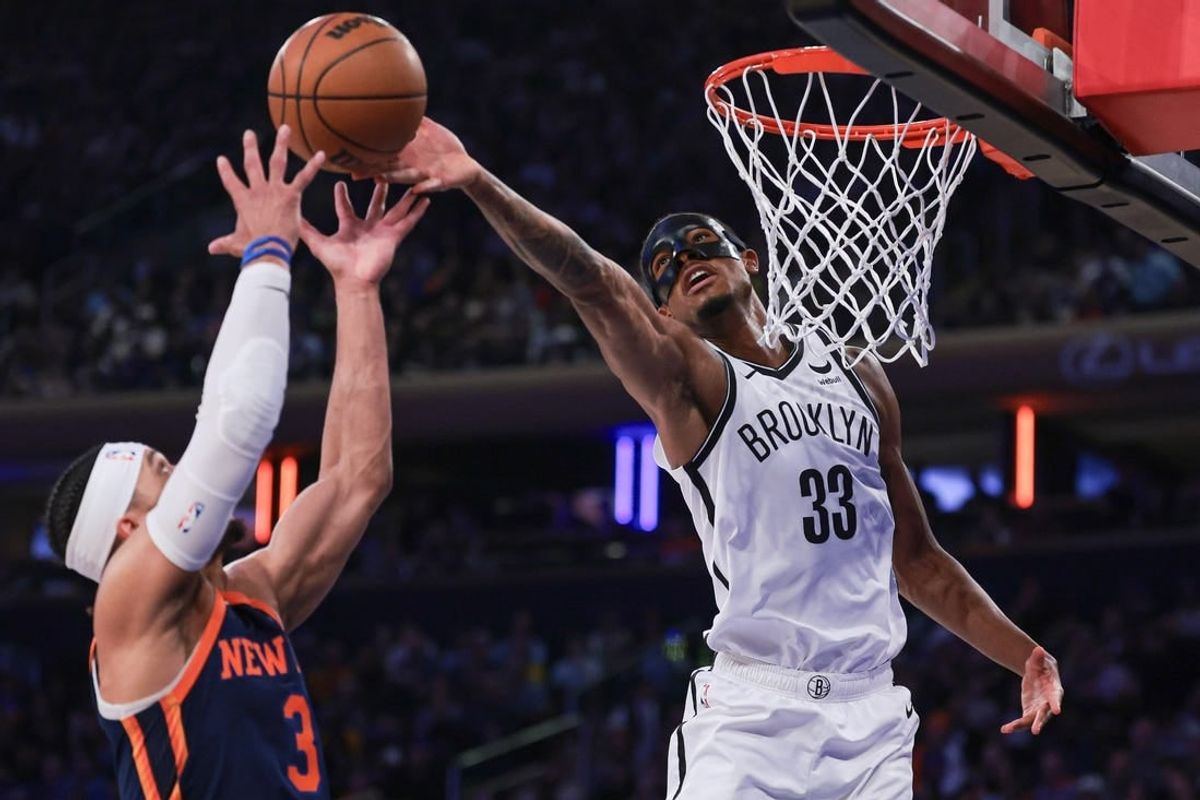 Apr 12, 2024; New York, New York, USA; Brooklyn Nets center Nic Claxton (33) rebounds against New York Knicks guard Josh Hart (3) during the first quarter at Madison Square Garden.