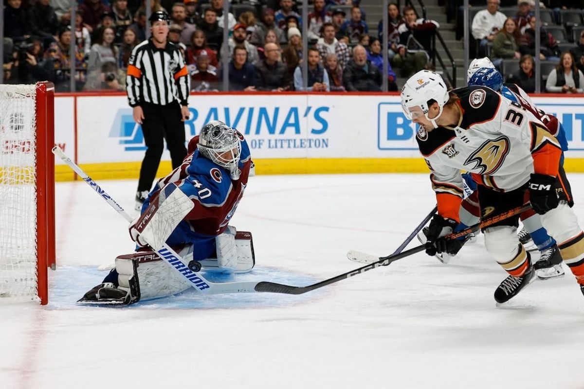 Dec 5, 2023; Denver, Colorado, USA; Colorado Avalanche goaltender Alexandar Georgiev (40) makes a save against Anaheim Ducks center Sam Carrick (39) in the first period at Ball Arena.