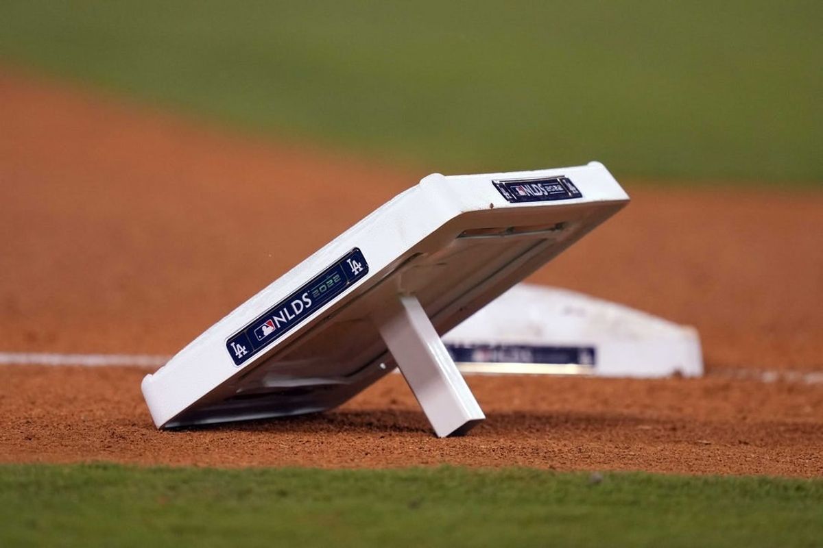 Oct 11, 2022; Los Angeles, California, USA; A detailed view of base with NLDS logo during during game at Dodger Stadium between the Los Angeles Dodgers and the San Diego Padres.