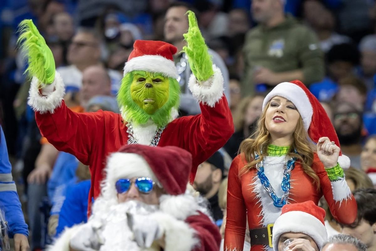 Dec 16, 2023; Detroit, Michigan, USA;  Detroit Lions fans dressed in Christmas attire react in the first half against the Denver Broncos at Ford Field.