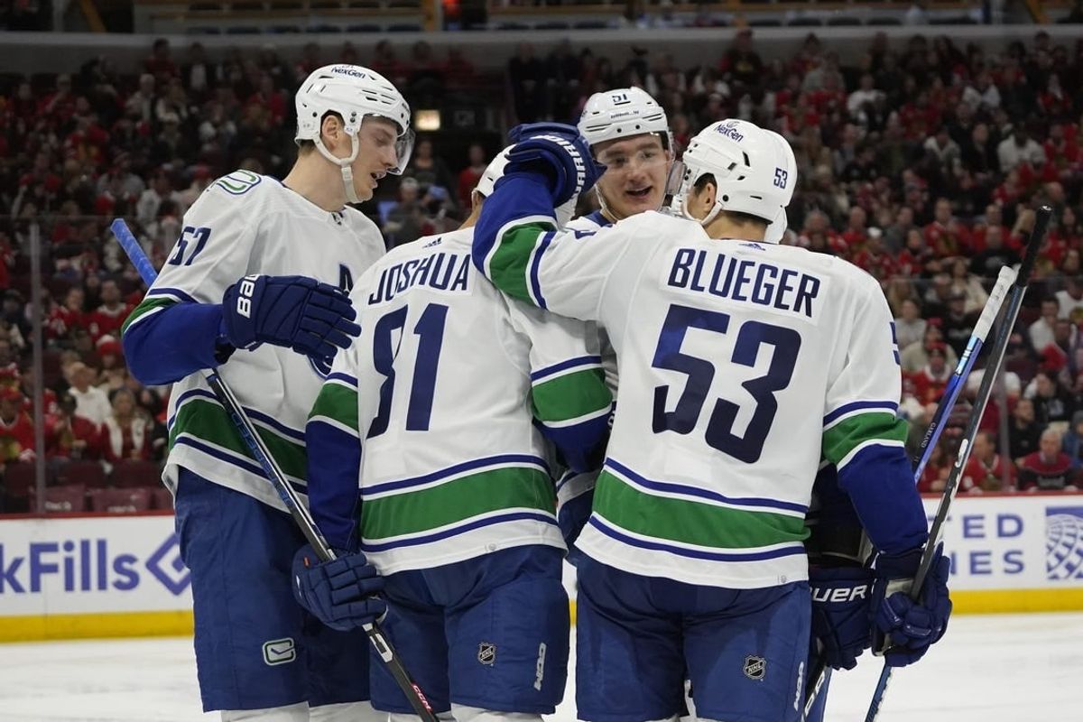 Dec 17, 2023; Chicago, Illinois, USA; Vancouver Canucks center Dakota Joshua (81) celebrates his goal against the Chicago Blackhawks during the second period at United Center.