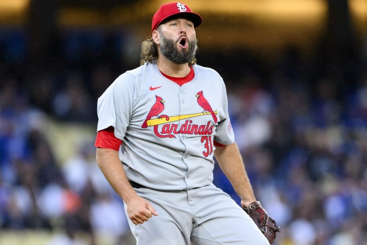 Mar 30, 2024; Los Angeles, California, USA; St. Louis Cardinals starting pitcher Lance Lynn (31) reacts after retiring the side with bases loaded during the first inning against the Los Angeles Dodgers at Dodger Stadium.