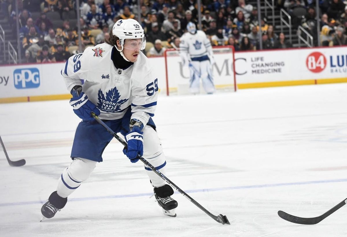Nov 25, 2023; Pittsburgh, Pennsylvania, USA;  Toronto Maple Leafs left wing Tyler Bertuzzi (59) moves the puck against the Pittsburgh Penguins during the second period at PPG Paints Arena.