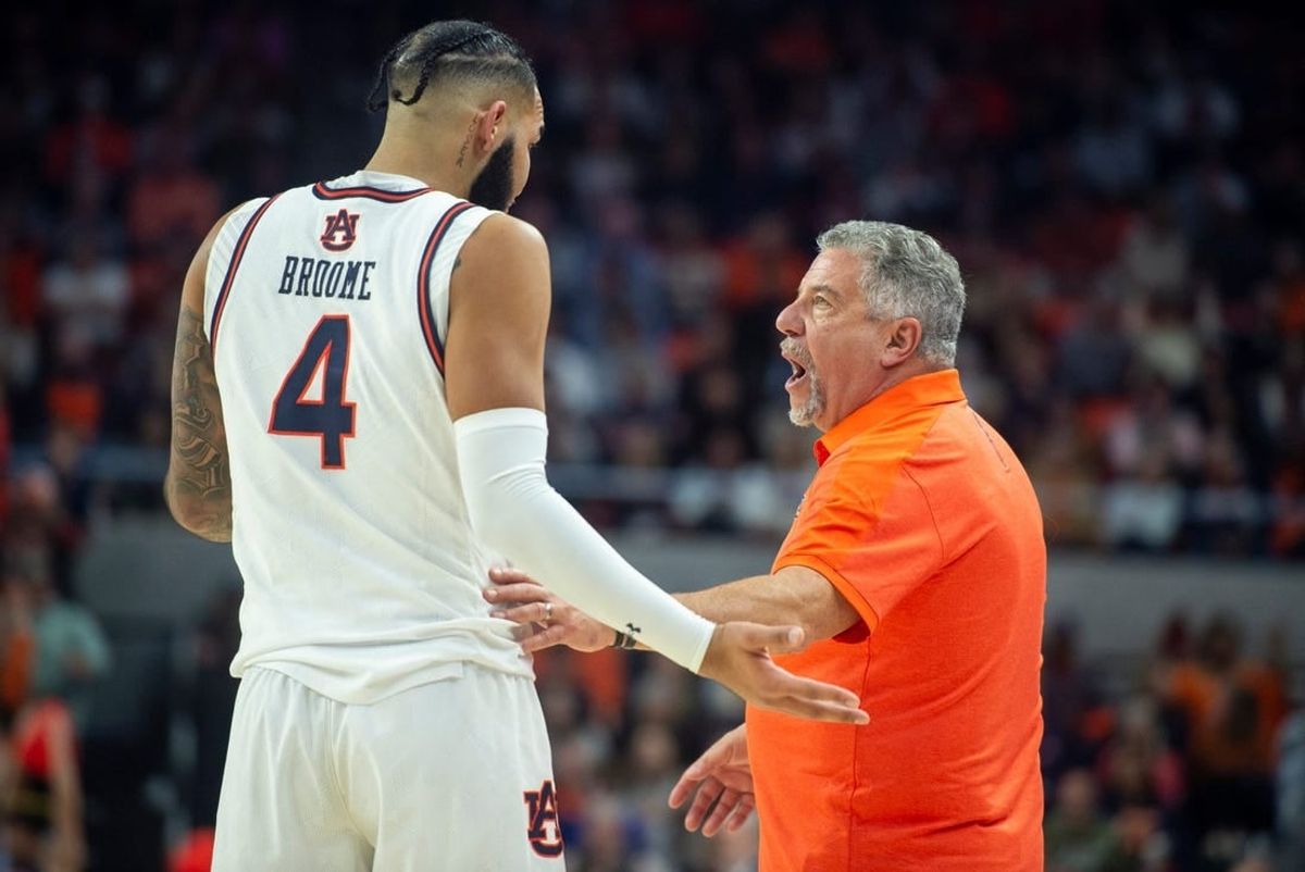 Auburn Tigers center Johni Broome (4) talks with Auburn Tigers head coach Bruce Pearl as Auburn Tigers take on Texas A&M Aggies at Neville Arena in Auburn, Ala., on Tuesday, Jan. 9, 2024. Auburn Tigers defeated Texas A&M Aggies 66-55.