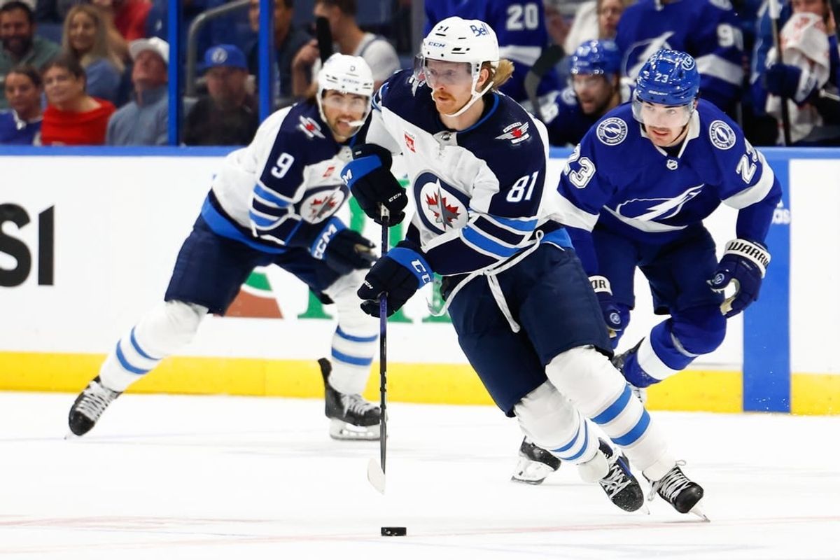 Nov 22, 2023; Tampa, Florida, USA; Winnipeg Jets left wing Kyle Connor (81) handles the puck during the second period against the Tampa Bay Lightning at Amalie Arena.