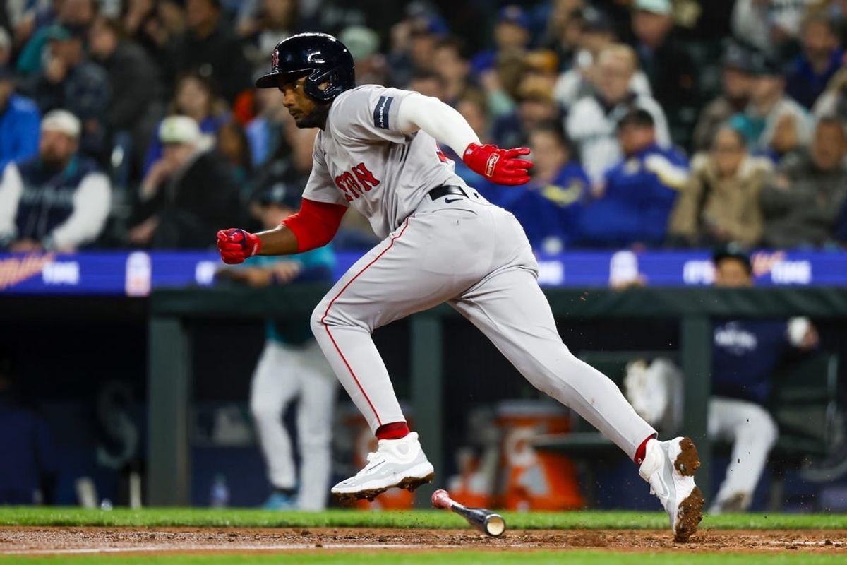 Mar 30, 2024; Seattle, Washington, USA; Boston Red Sox third baseman Pablo Reyes (19) hits an RBI-fielders choice against the Seattle Mariners during the fifth inning at T-Mobile Park.