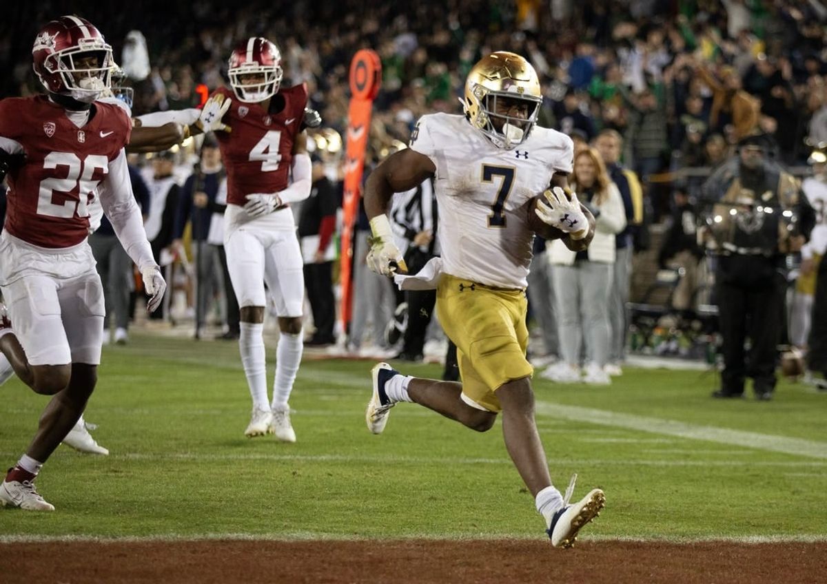 Nov 25, 2023; Stanford, California, USA; Notre Dame Fighting Irish running back Audric Estim   (7) breaks free for another touchdown run against the Stanford Cardinal during the third quarter at Stanford Stadium.