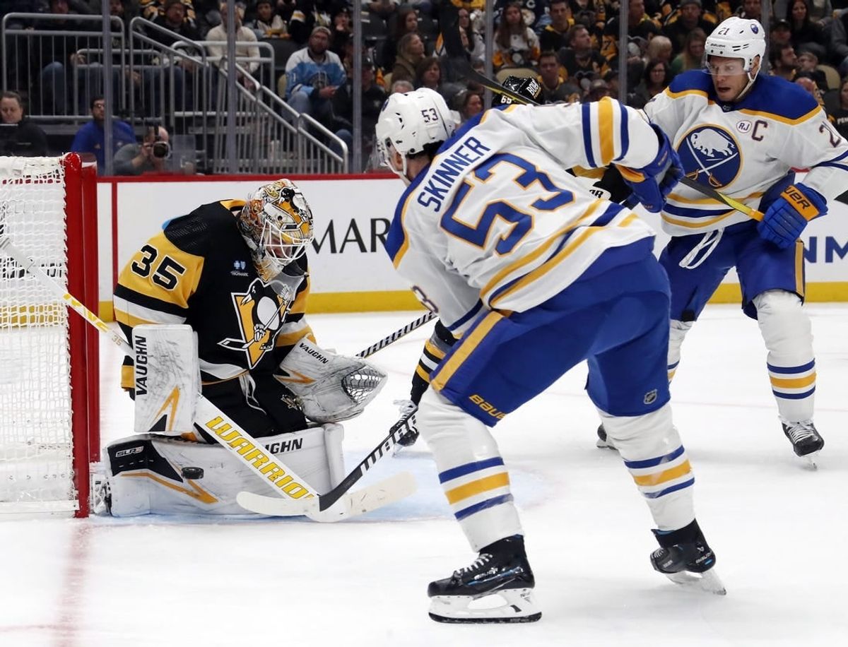 Nov 11, 2023; Pittsburgh, Pennsylvania, USA;  Pittsburgh Penguins goaltender Tristan Jarry (35) makes a save against Buffalo Sabres left wing Jeff Skinner (53) during the second period at PPG Paints Arena.
