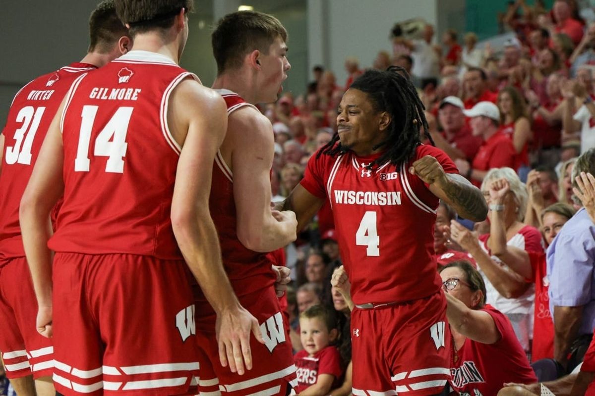 Nov 22, 2023; Fort Myers, FL, USA;  Wisconsin Badgers guard Kamari McGee (4) reacts a after a play against the Southern Methodist Mustangs in the first half during the Fort Myers Tip-Off championship game at Suncoast Credit Union Arena.