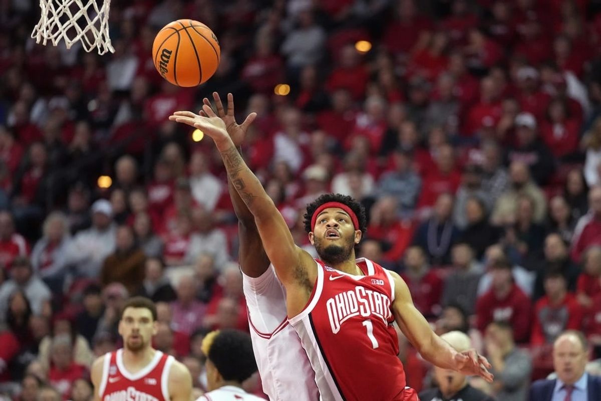 Feb 13, 2024; Madison, Wisconsin, USA;  Ohio State Buckeyes guard Roddy Gayle Jr. (1) scores against Wisconsin Badgers guard AJ Storr (2) during the first half at the Kohl Center.
